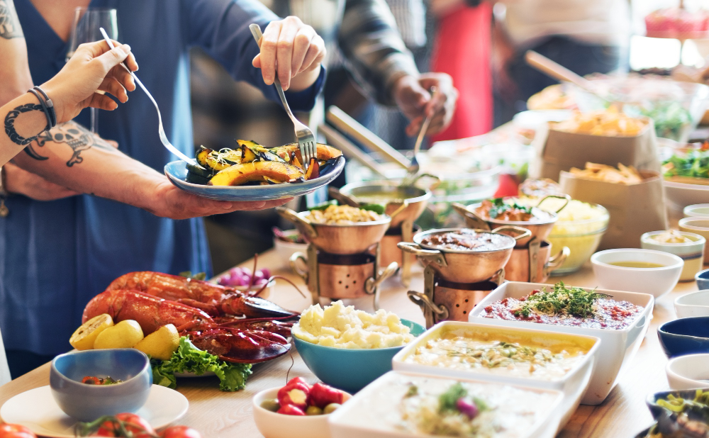 Group of diverse people are having lunch together
